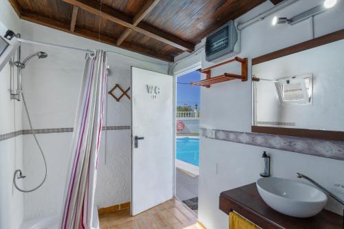 a bathroom with a shower and a sink at Villa Jomeca in Salobre