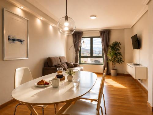 a living room with a white table and chairs at Villa María Arrecife Beach in Arrecife