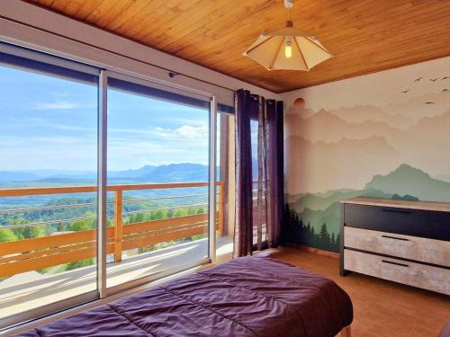 a bedroom with a bed and a large window at Grand appartement pour 12 pers. avec balcon sud, WIFI, parking et proche pistes – St Michel de Chaillol - FR-1-393-11 in Saint-Michel-de-Chaillol