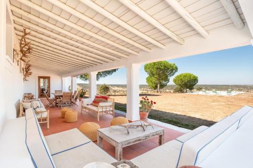 an outdoor patio with a table and chairs at Authentic Alentejo Farmhouse in Arraiolos
