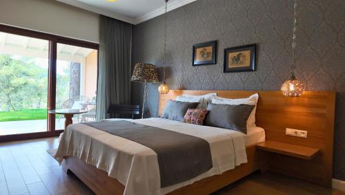 a bedroom with a large bed in a room at D&C Göcek Hotel in Göcek