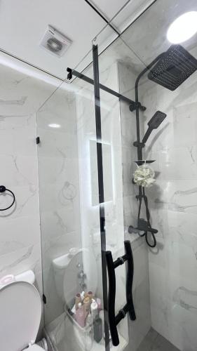 a bathroom with a shower and a toilet in it at Jawharat Tetouan in Souani