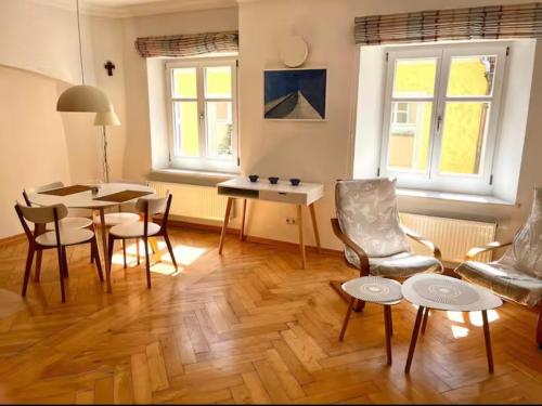 a living room with a table and chairs at FeWo3 in Lindau