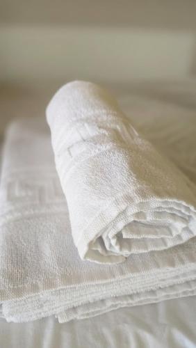 a white pillow sitting on top of a bed at Albergue La Cuba in La Cuba