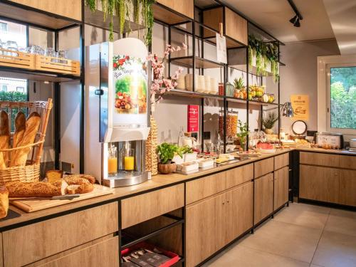 a bakery counter with a lot of food at Ibis Roquebrune Cap Martin Menton in Menton