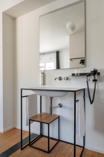 a bathroom with a sink and a mirror at Casa al Sole in Ortisei