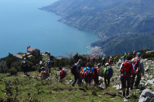 a group of people walking up a mountain at Hotel L'Antico Convitto in Amalfi