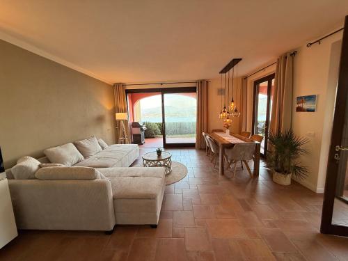 a living room with a couch and a table at Perla di Lago Maggiore in Oggebbio