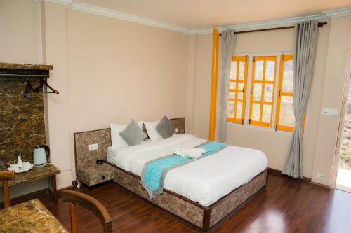 a bedroom with a bed in a room at Nagarkot Zip Coaster Pvt Ltd in Nagarkot