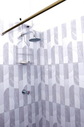 a bathroom with a shower with a shower head at Sharays Hideaway in Bull Bay