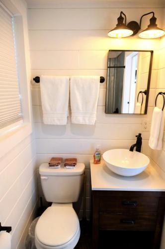 a bathroom with a toilet and a sink at NEW! Cozy Container Home at Cliffside #4 in Orderville