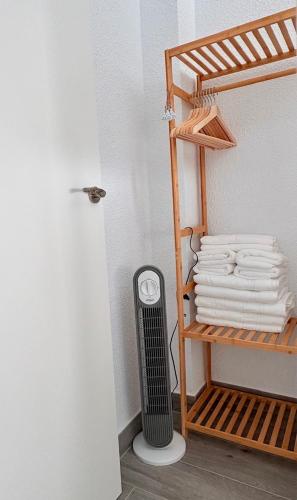a room with a heater and a stack of towels at Apartamento Galvana in Peniscola