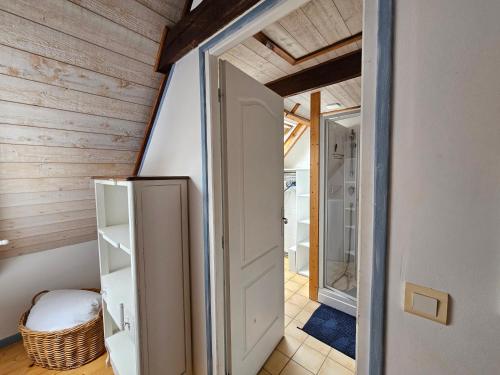 a room with an open door in a house at penty vero in Plobannalec-Lesconil