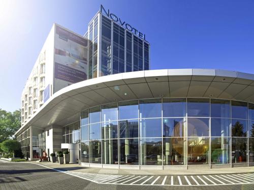 a large building with a large glass facade at Novotel Warszawa Airport in Warsaw