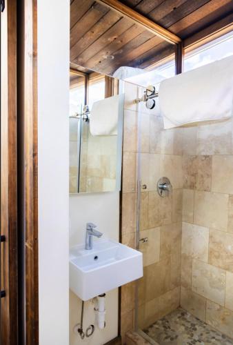 a bathroom with a sink and a shower at NEW! Modern Cabin Tiny Home at Cliffside #3 in Orderville