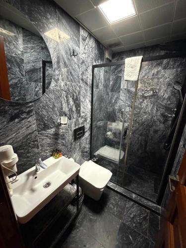 a bathroom with a sink and a shower at The Basilissis Gulhane in Istanbul