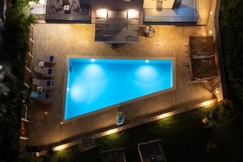 an overhead view of a large screen tv on a street at night at Allas Villa Heated Pool in Chania