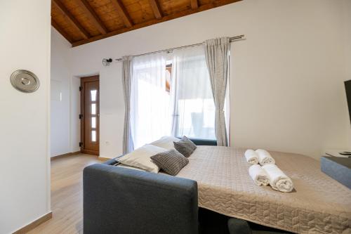 a room with a bed and a large window at Holiday house "Maria" in Privlaka