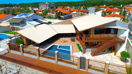an aerial view of a house with a swimming pool at Luxury Oceanfront House - Beachfront - Pool in Aquiraz