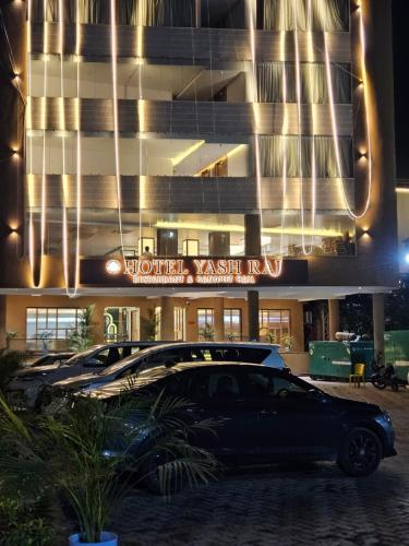 a car parked in front of a building at night at Hotelyashraj in Pipra Dewās