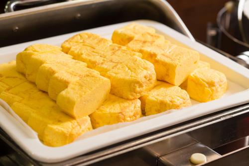 a tray filled with tofu in an oven at Ark Hotel Osaka Shinsaibashi -ROUTE INN HOTELS- in Osaka