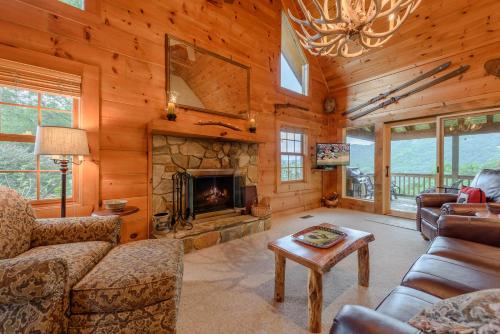 a living room with a couch and a fireplace at Valle View in Valle Crucis