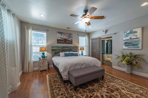 a bedroom with a bed and a ceiling fan at Red River Retreat in Paso Robles
