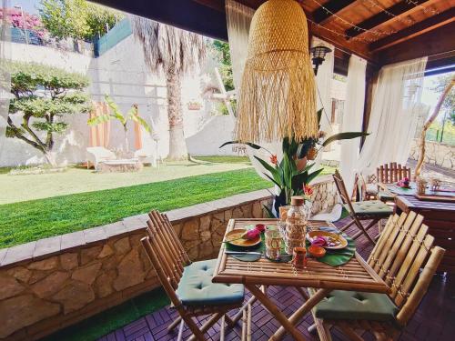a table and chairs on a patio with food on it at Favola B&B in Pescara