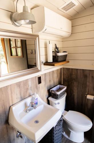 a bathroom with a sink and a toilet at NEW! Unique Modern Glamping Chalet #5 in Orderville