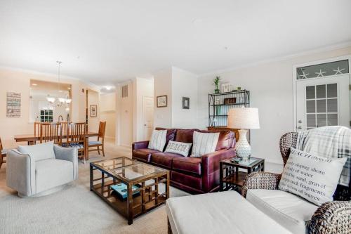 a living room with a couch and a table at Bear Trap Dunes - 56E October Glory in Ocean View