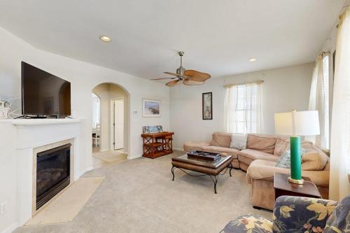 a living room with a couch and a fireplace at Bayside Resort - 36398 Azalea Ave in Selbyville