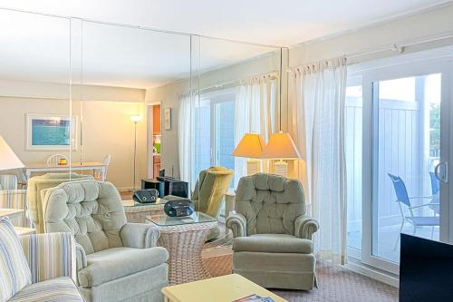 a living room with a couch and two chairs and a table at Sunspot Condo --- 2 McKinley Ave, Unit 103 in Dewey Beach