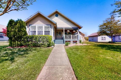 a house with a sidewalk in front of a yard at Forest Reach --- 33720 Chatham Way in Frankford