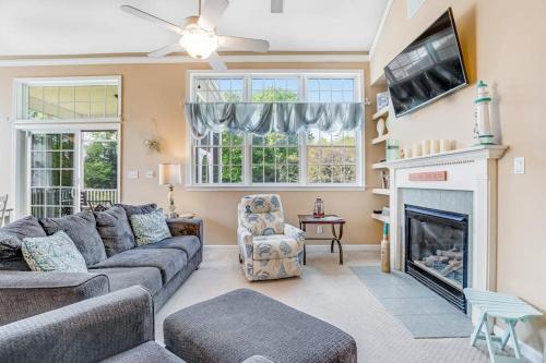 a living room with a couch and a fireplace at Bear Trap Dunes - 28 October Glory in Ocean View