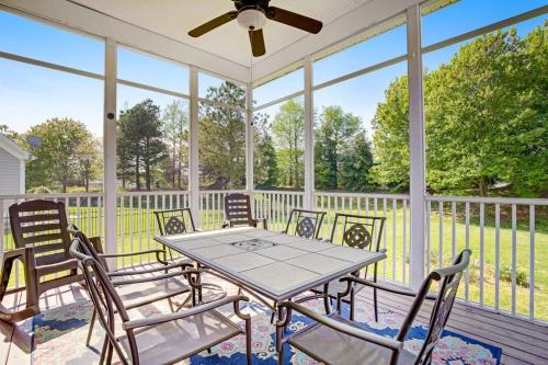 a screened porch with a table and chairs at Bear Trap Dunes - 28 October Glory in Ocean View
