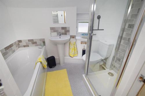 a bathroom with a sink and a toilet and a shower at 1 Bed in Mumbles oc-hh1210 in The Mumbles
