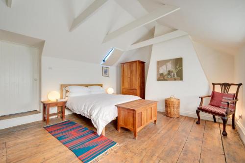 a bedroom with a bed and a table and a chair at 2 Bed in Walsham-le-Willows oc-gabpla in Walsham le Willows