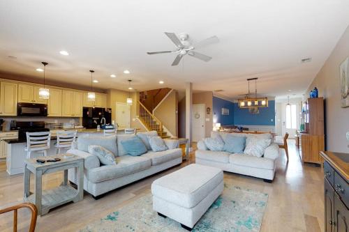 a living room with two couches and a kitchen at Bishops Landing -- 16985 Bellevue in Millville