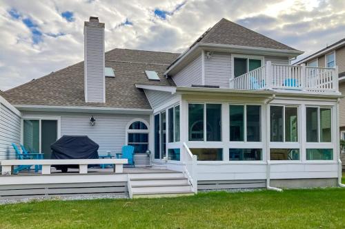 a house with a deck and a patio at Salt Pond --- 494 Bethany Loop in Bethany Beach