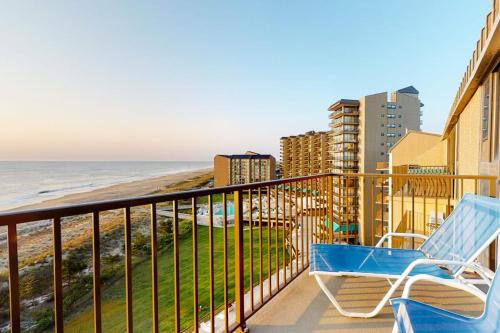 a balcony with two chairs and the ocean at Sea Colony - 904 Dover House Rd in Bethany Beach