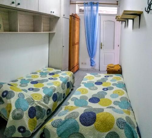 Posteľ alebo postele v izbe v ubytovaní Monseñor