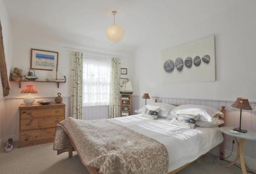 a bedroom with a large white bed and a window at 1 Bed in Southwold oc-aapebb in Southwold