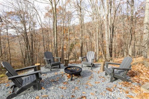 a group of chairs sitting around a fire pit at Whiskey Ridge in Boone