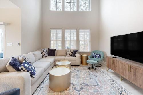 a living room with a couch and a flat screen tv at Bishops Landing --- 38480 Carroll Dr in Millville