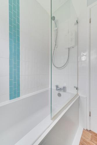 a white bathroom with a shower and a sink at 2 Bed in Walcott oc-2282 in Walcott