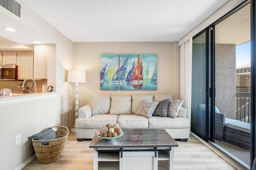 a living room with a couch and a table at Sea Colony --- 208 Brandywine House in Bethany Beach