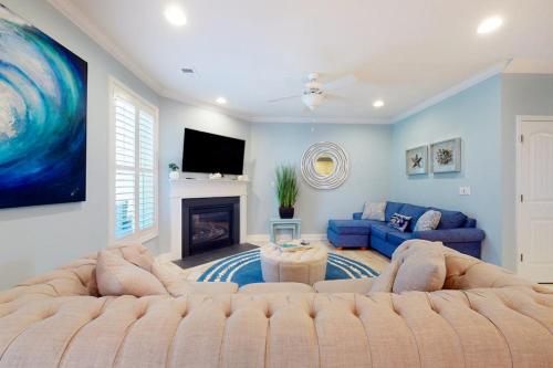 a living room with a large couch and a fireplace at Bayside Resort 2639zero Seabreeze Lndg in Selbyville