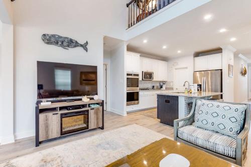 a large kitchen with a couch and a table at Bayside Resort - 28031 Sea Dock in Selbyville