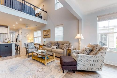 a living room with a couch and a table at Bayside Resort - 28031 Sea Dock in Selbyville