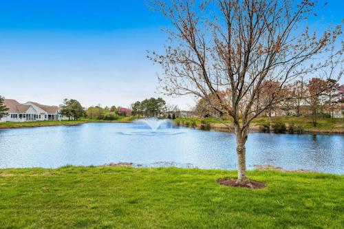 a tree in the grass next to a lake at Bear Trap Dunes --- 124 October Glory Ave Unit #B in Ocean View